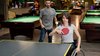 Disabled girl in a wheelchair playing table tennis